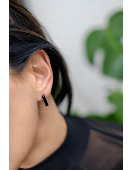 Black shiny stainless steel rectangular earrings with a minimalist and elegant design.