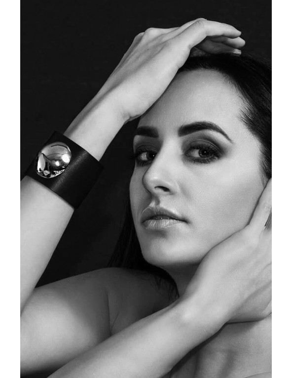 Wide black leather bracelet with polished stainless steel dome