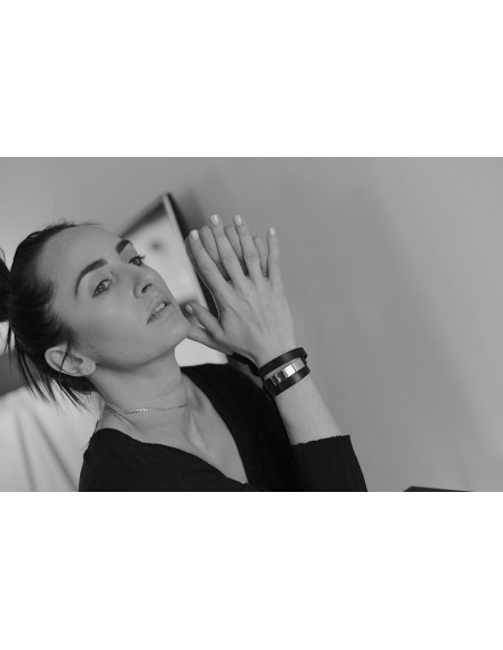 Triple-wrap women’s black leather bracelet with silver stainless steel detail and black clasp.