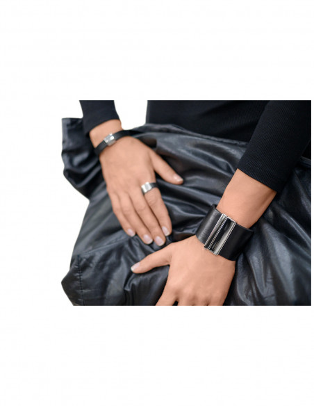 Wide black leather bracelet with shiny gold-plated stainless steel clasp