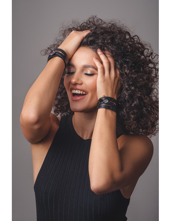 Black leather bracelet with holes and silver accents