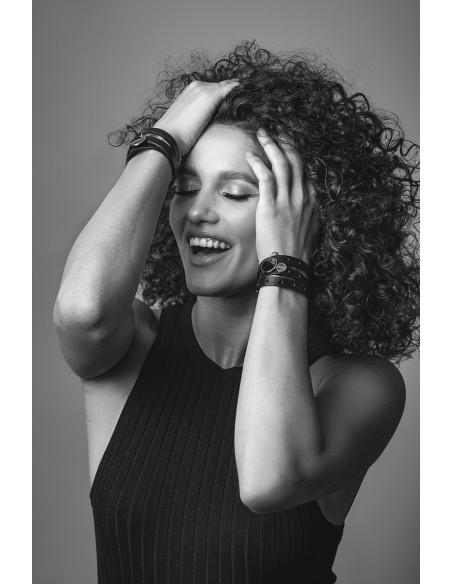 Black leather bracelet with gold charms and adjustable clasp