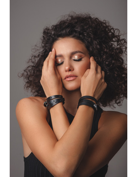 Black leather bracelet with stainless steel charms