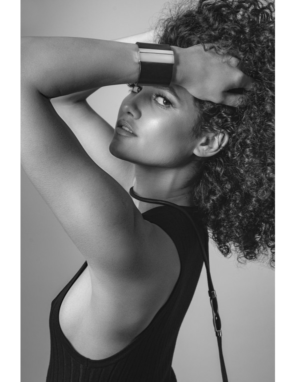 Wide black leather bracelet with shiny gold-plated stainless steel clasp