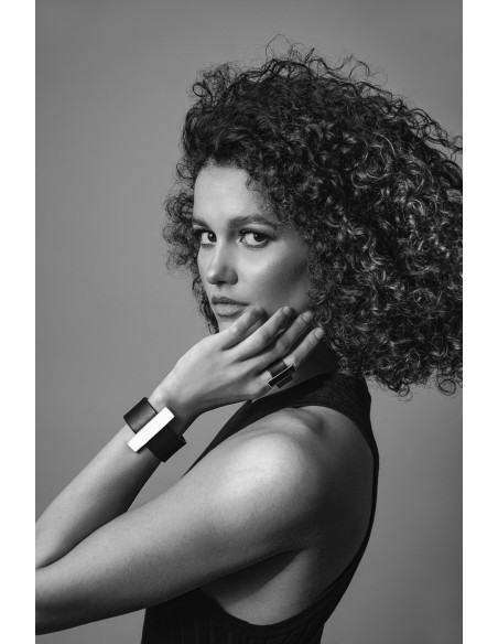 Black leather bracelet with a gold-plated steel accent and magnetic clasp