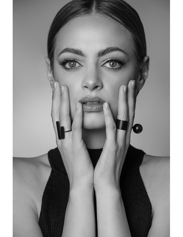 Matte black stainless steel earrings with two decorative spheres