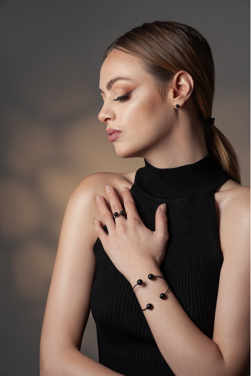 Black matte stainless steel ball stud earrings with stud fastening.