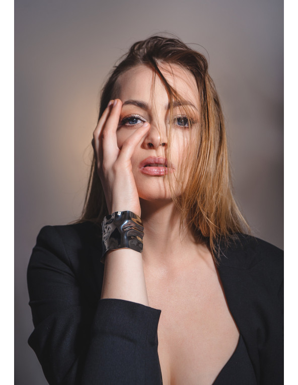 Wide crumpled stainless steel bracelet with a polished finish