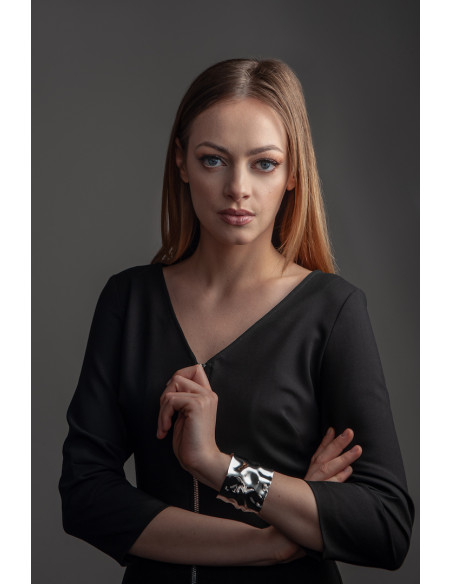 Wide crumpled stainless steel bracelet with a polished finish