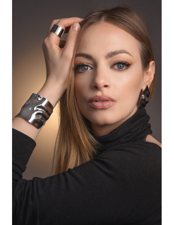 Wide crumpled stainless steel bracelet with a polished finish