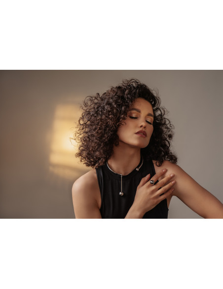 Stainless steel ring with large silver sphere