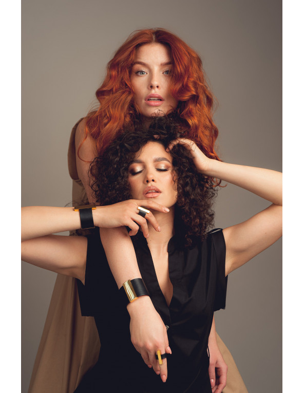 Wide black leather bracelet with glossy stainless steel clasp