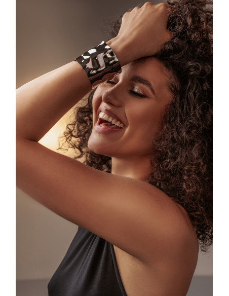 Wide crumpled stainless steel bracelet with a polished finish