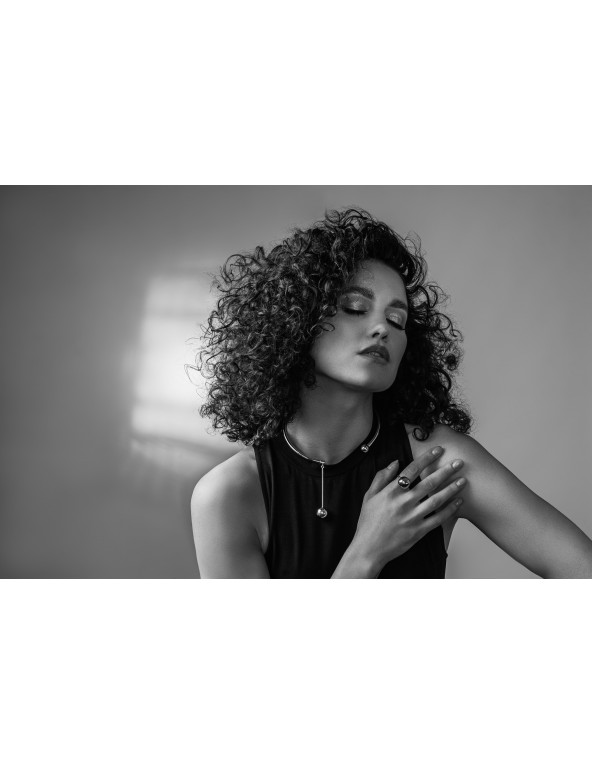 Stainless steel choker with decorative sphere in minimalist style