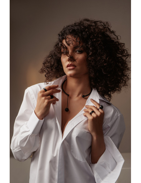 Black matte stainless steel necklace with decorative sphere.