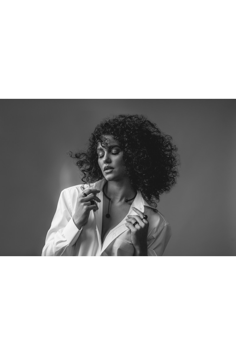 Black matte stainless steel necklace with decorative sphere.