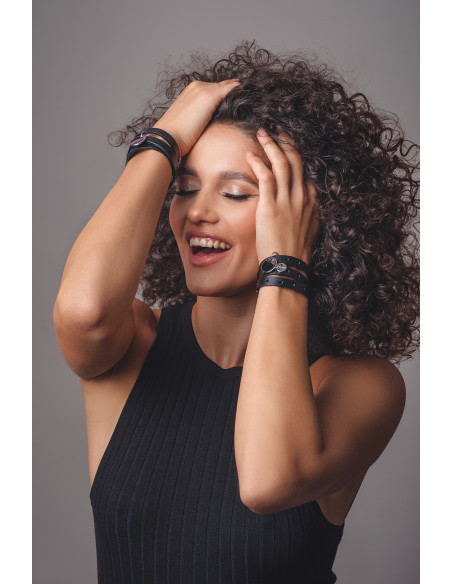 Black leather bracelet with holes and matte steel charms