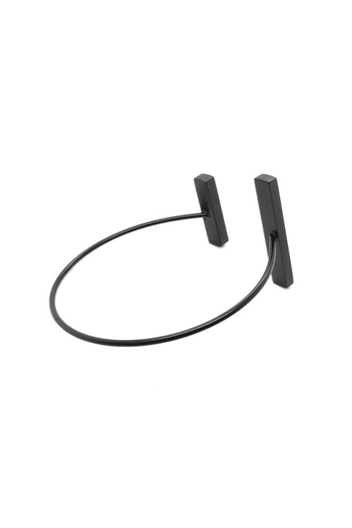 A delicate and raw jewellery set made of black stainless steel