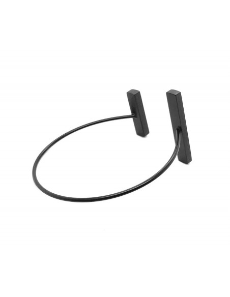 Delicate bracelet made of black matte stainless steel in a minimalist style.