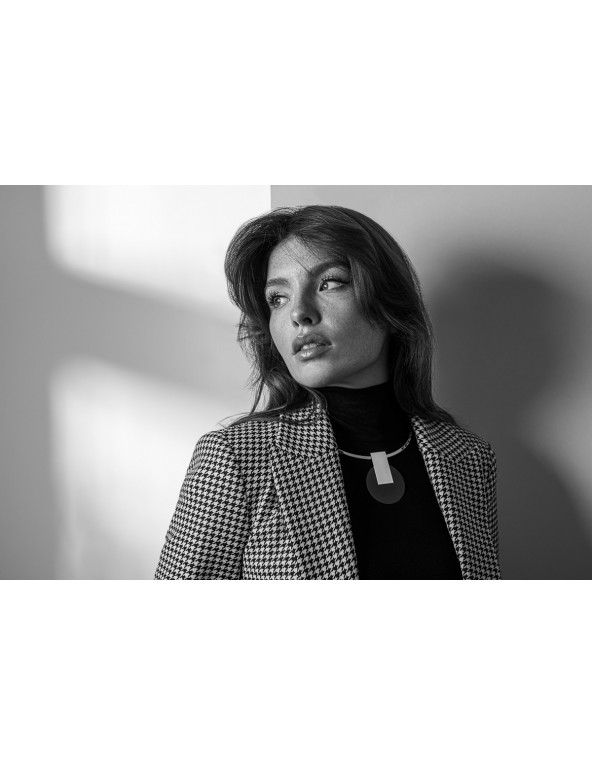 Stainless steel choker necklace with a decorative black and silver pendant