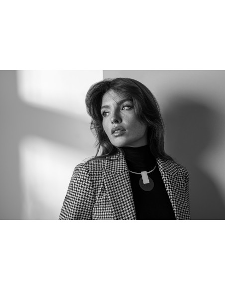 Stainless steel choker necklace with a decorative black and silver pendant