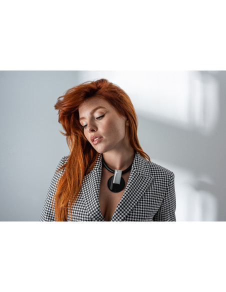 Necklace made of leather and decorative shiny pendant