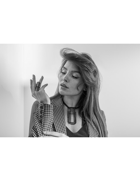 Large black matte stainless steel ring with a modern minimalist design