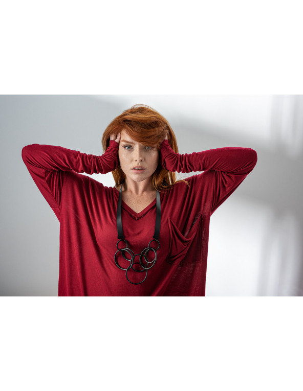 Long necklace made of black natural leather with matte black stainless steel circular elements.