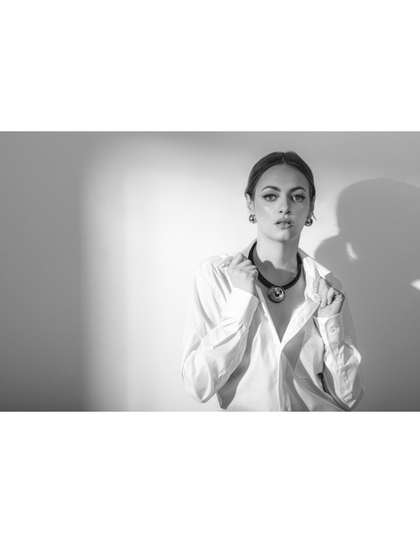 Black leather necklace with a shiny silver stainless steel pendant