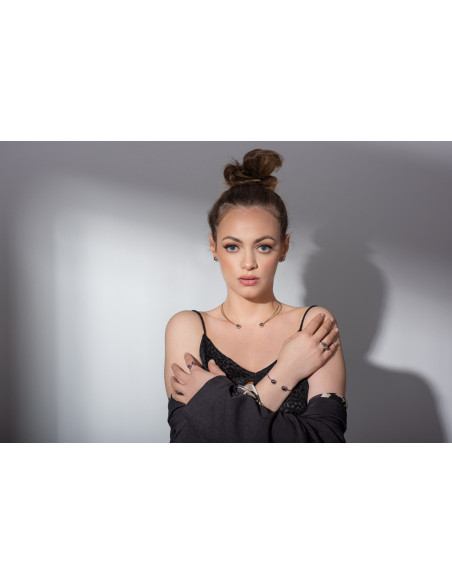 Stainless steel ring with decorative beads.