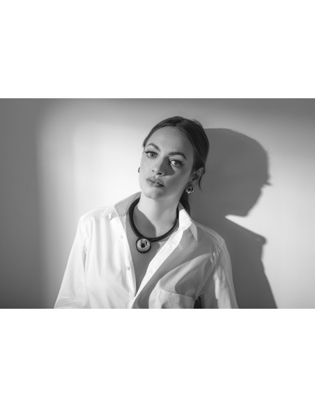 Black leather necklace with a shiny silver stainless steel pendant