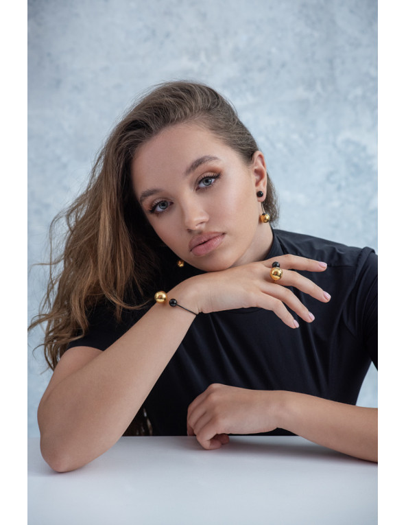 Stainless steel jewelry set with a large golden sphere – ring and earrings in an elegant gift set.