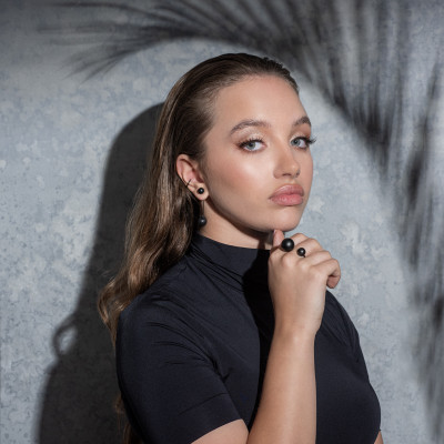 Matte black stainless steel ring with two spheres in minimalist style 2