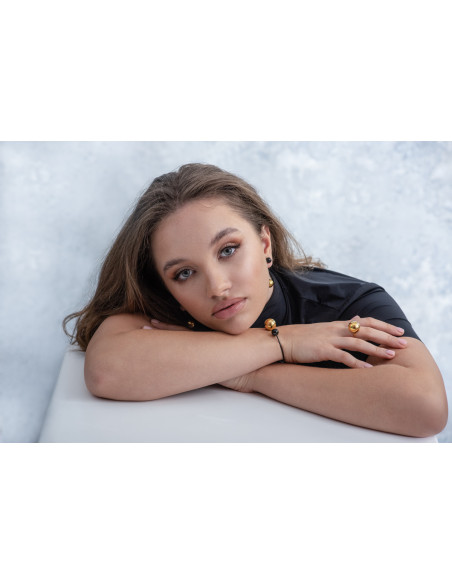 Stainless steel jewelry set with a large golden sphere – ring and earrings in an elegant gift set.