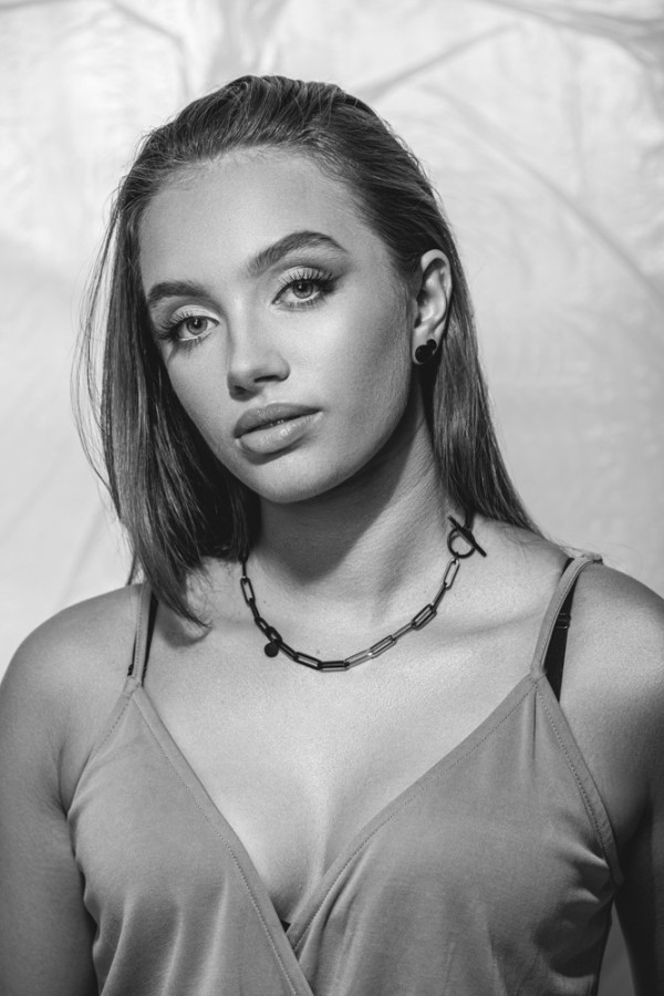 Short black matte stainless steel necklace with large gold-accented links. 2