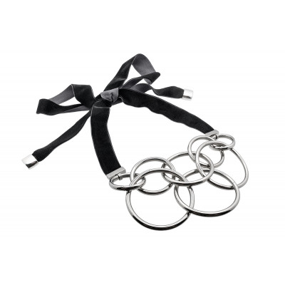 Adjustable stainless steel circles necklace with a black velvet ribbon tied into a bow.