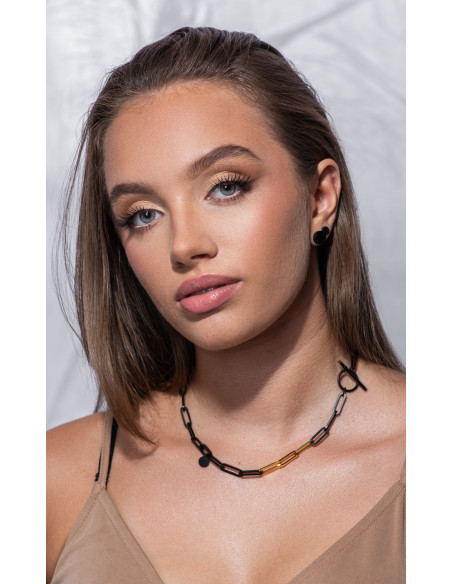 Short black matte stainless steel necklace with large gold-accented links.
