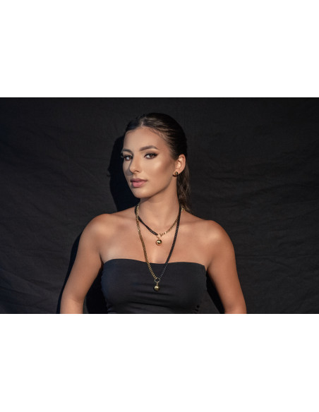 Long adjustable gold-plated stainless steel necklace with ball pendant in gold and matte black tones.