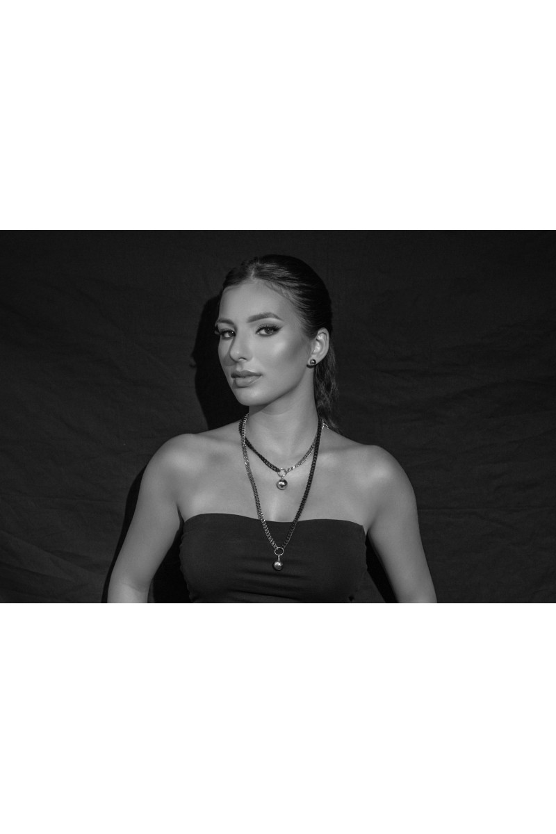 Long adjustable stainless steel necklace with a 15 mm ball in silver and matte black tones.