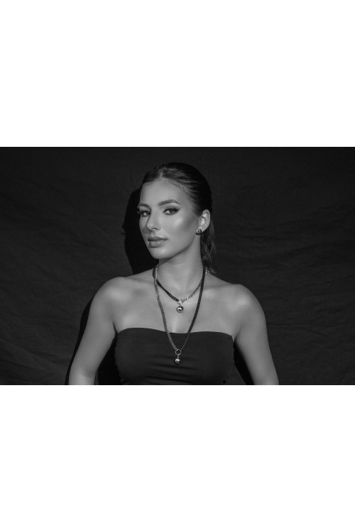 Long adjustable stainless steel necklace with a 15 mm ball in silver and matte black tones.