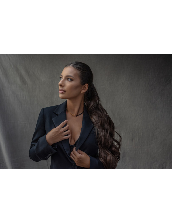 Delicate gold-plated stainless steel necklace in gold and matte black tones.