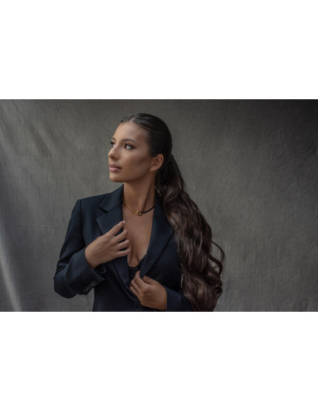 Delicate gold-plated stainless steel necklace in gold and matte black tones.