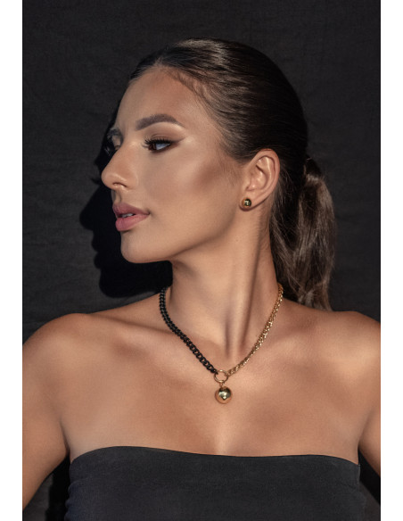 Short adjustable gold-plated stainless steel necklace with a sphere in gold and matte black tones.