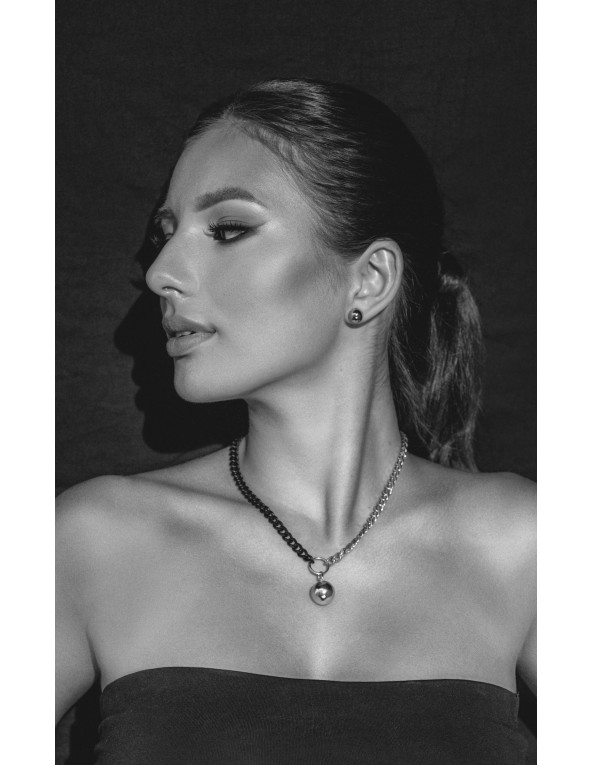 Short adjustable stainless steel necklace with a polished silver sphere.