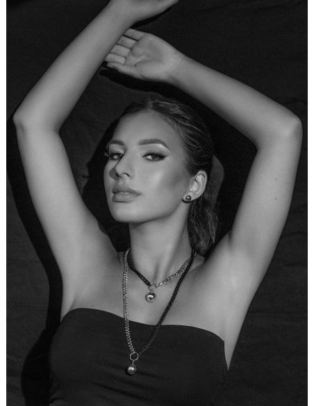 Short adjustable stainless steel necklace with a polished silver sphere.