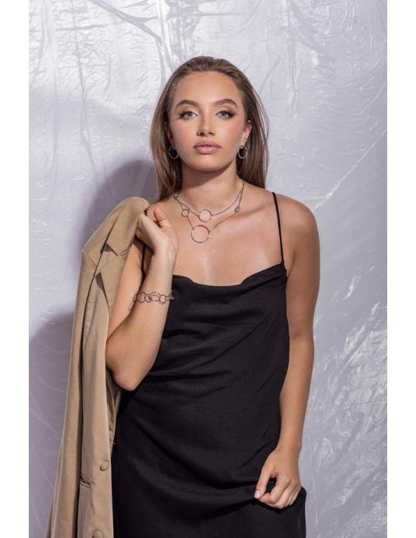 Silver stainless steel bracelet with movable elements and minimalist modern design.