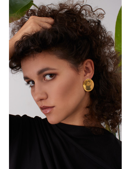 Gold stainless steel disc hoop earrings with a shiny finish and modern minimalist style.