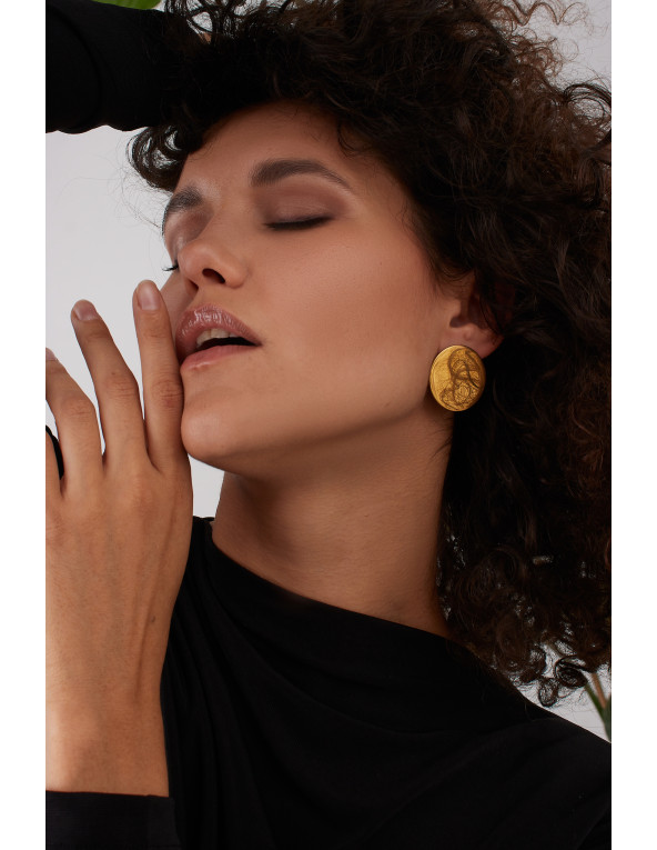 Gold stainless steel disc hoop earrings with a shiny finish and modern minimalist style.