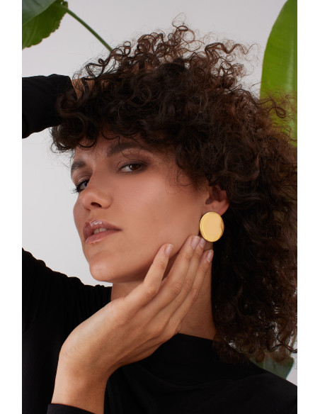 Gold stainless steel disc hoop earrings with a shiny finish and modern minimalist style.