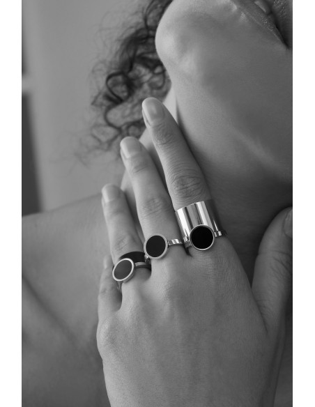 Minimalist stainless steel ring with a black stone on a silver band